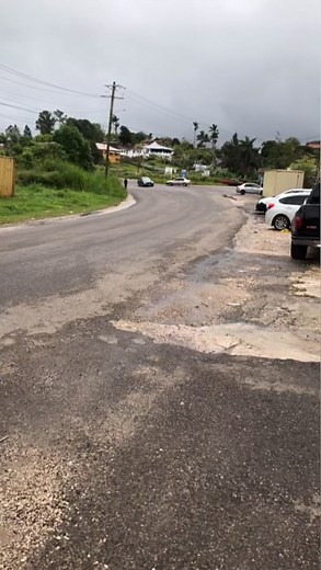 Exploring Suburban Roads: Cars on a Wet Journey