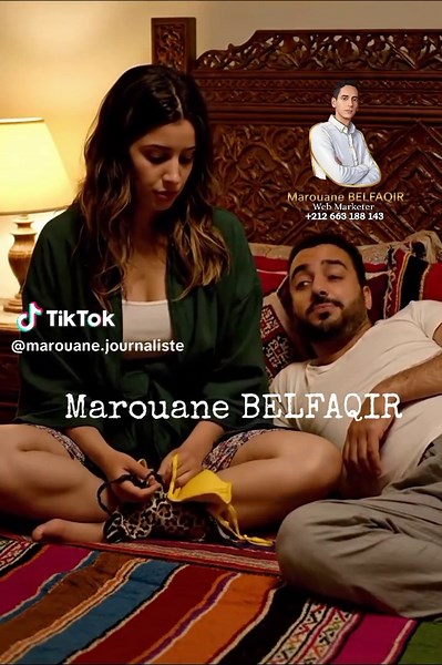 Veo 3 Prompt – Moroccan Bedroom Scene – Night 🎬 Scene Description: Interior – Moroccan bedroom – night. A warm, intimate room with carved wood furniture and thick blankets. Soft yellow light from a bedside lamp creates a cozy atmosphere. The bed is large, with traditional Moroccan textiles. 👩 Woman: Moroccan woman in her 30s, sitting on the bed, holding two bras — one with leopard print patterns, the other yellow. She looks slightly frustrated but calm. 👨 Man: Moroccan man in his 40s, lying o