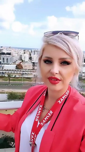 Stylish Red Blazer: Cityscape Fashion Statement