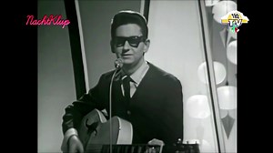 Pretty Paper is a classic Christmas Pop and Country Ballad track with a melancholy feel, performed by the American singer-songwriter Roy Orbison. The song was released in 1963 as a standalone single. Roy Orbison (1936–1988) was an American singer and songwriter. He is famed for his powerful, highly nuanced Baritone voice, his impressive vocal range (three-octave range), and his signature look featuring black clothing and dark sunglasses. He was a pioneer of the Rockabilly and Operatic Pop styles