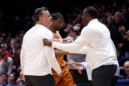 Ryan Anderson, ex-Xavier coach at Texas, runs onto court at First Four