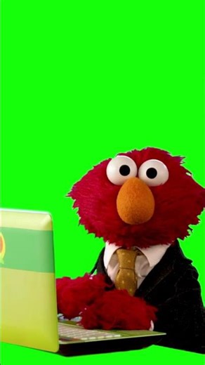 Elmo typing on a laptop green/blue screen