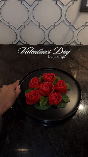 Rose dumplings for Valentine’s Day♥️ Dumpling Wrappers Ingredients 320 g all-purpose flour 190–210 g colored water (warm water mixed with natural food coloring, beet powder, or pitaya powder) Instructions In a bowl, combine flour and colored water. Mix until a shaggy dough forms. Knead for 8–10 minutes until smooth and elastic. Cover and let rest for 30 minutes. Ground Chicken Filling Chicken or chopped chicken Soy sauce Green onions, chopped Finely diced carrots Sesame oil Garlic Fresh ginger W