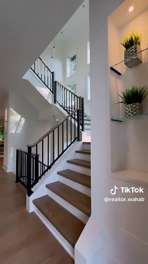 310 Johnson St SW — A timeless escape. A masterpiece of modern design built by AR Design Group and designed by Hallstrom Associates. Perfectly positioned just steps from downtown Vienna. • Wide-plank oak floors, floating ceilings, soundproof bedrooms • Chef's kitchen w/ waterfall quartz island, JennAir appliances, catering kitchen & butler's pantry • Private primary suite w/ coffee bar, heated floors, spa bath, steam shower & freestanding tub • Bright, fully finished walkout basement w/ built-in