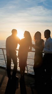 Here, twilight becomes a gathering place. Every silhouette, every smile, every shared toast becomes part of the story you’ll carry long after the journey ends. | Paul Gauguin Cruises