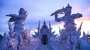 Walk across a sea of dismembered arms, come face-to-face with the floating head of The Terminator, and tour sparkling white, intricately wrought architecture like you’ve never seen. Stepping into Thailand’s Wat Rong Khun Temple is like entering an otherworldly work of art. | Great Big Story