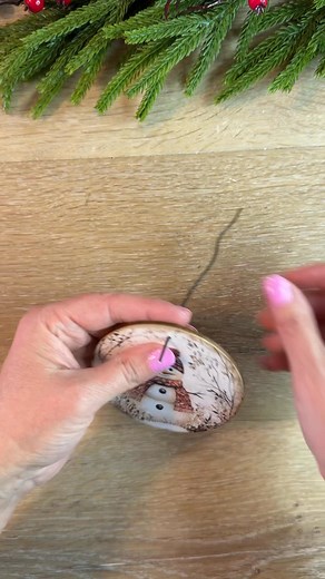 This snowman ornament idea is so quick and easy. You can make these in a matter of minutes. The wood round is 3.5” and the free printable is from Trailside Designs. #ornaments #snowmandecor #christmasdecor #christmasornaments #easycrafts #christmascrafts | Farmhouse Stencil Shoppe