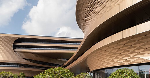 zaha hadid architects' fluid infinitus plaza takes shape as an infinity symbol