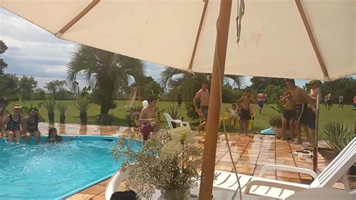 Friends Jump Off Chair into Pool