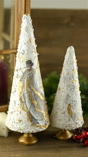 144 reactions · 22 shares | A touch of snow, a shimmer of gold, and a whisper of Christmas magic. ❄️✨ We used a napkin with an angel motif, snow paste, and gold flakes to bring these cones to life. Would you try this technique too?   Full tutorial on YouTube: @haidihai.ro #decoupage, #christmascrafts, #haidihai, #handmadechristmas, #snowpaste, #napkinart, #angeldecor, #winterdecor, #crafttutorial, #holidaycrafts | haidihai | Facebook