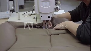 A seamstress is sewing at a sewing machine Stock Video
