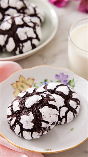 These decadent Chocolate Crinkle Cookies are fudgy, rich, and pure chocolate goodness! They’re the perfect holiday cookie with a soft almost molten interior and a crisp edge; best of all they come out of the oven fully decorated. Recipe on the blog 👉 link in bio👈 #preppykitchen #baker #recipevideo | Preppy Kitchen