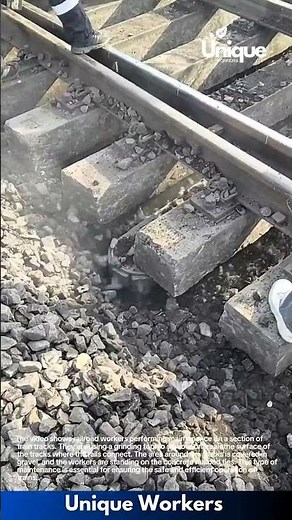 Railroad Maintenance: Workers Repairing Track with Grinding Tool