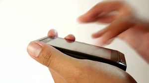 clip-3425810-fingers-typing-text-on-cellphone