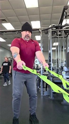 Standing Squats using straps to improve knee flexion and leg strength