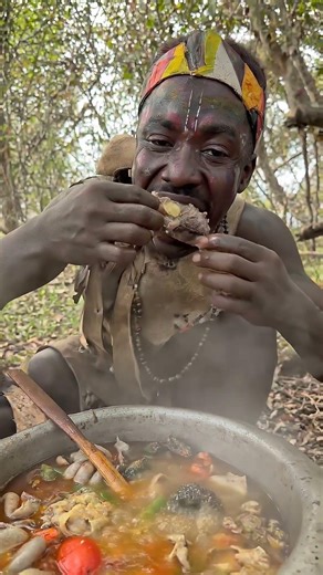 Hadzabe Sharing Food Around the Fire #Hadzabe #TribalLife #TraditionalFood #WildFood #shortsfeed
