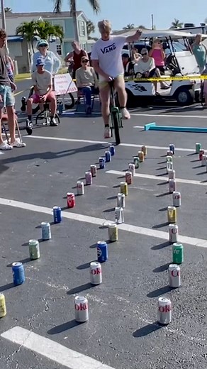 238K views · 1.3K reactions | Most cans crushed by unicycle in one minute 參22 by Everett Robinson  | Guinness World Records | Facebook