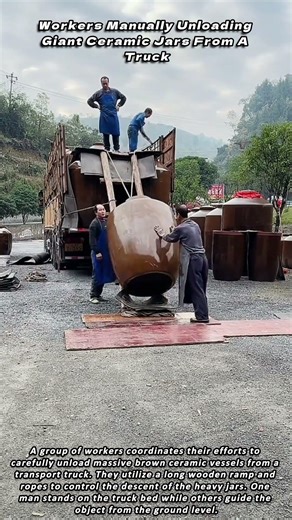 Workers Manually Unloading Giant Ceramic Jars From A Truck
