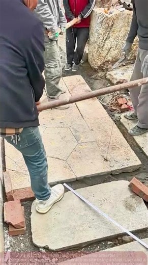 Stone Slab Cutting Site: Workers Measure and Position Precisely