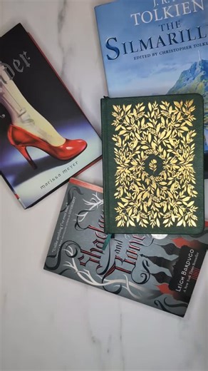 Britt on Instagram: "Considering I have a 600+ page book I'm currently reading I felt like it was safe to set up 2026 in my reading journal. A whole new book shelfie for the new year. Washi from Notebook Therapy Lunar Mystery set Stickers from Stickii Notebook from Archer and Olive"