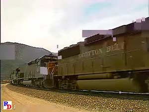 A Southern Pacific detoured train runs over the Santa Fe tracks on Cajon Pass and then a beautiful elevated shot of a Santa Fe train. Both trains have helpers. From the Pentrex show "Cajon 2 – w/ Cab Ride" https://rfd.video/Cajon2Combo | Railfan Depot