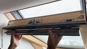 Hands skillfully demonstrate the intricate installation of a skylight window for enhanced natural light