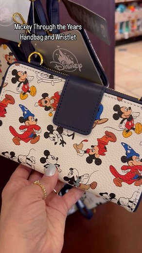Cute Disney bags don’t have to be expensive! This handbag and wallet set featuring Mickey Mouse through the years is surprisingly affordable: $44.99 for the bag and $34.99 for the wristlet. °o° #mickeymouse #mickeythroughtheyears #sorcerermickey #disneybag #theemporium | The Disney Fashionista
