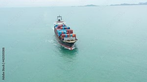 Aerial of smart cargo ship carrying container and running for export goods from cargo yard port to other ocean concept freight shipping ship and related to marine insurance,Logistics Supply Chain