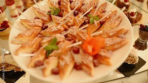 dessert buffet pastries cakes biscuits catering buffet at holiday party, wedding in restaurant. small cakes decorated with fresh berries stand transparent tray. presentation food decoration serving Stock Video