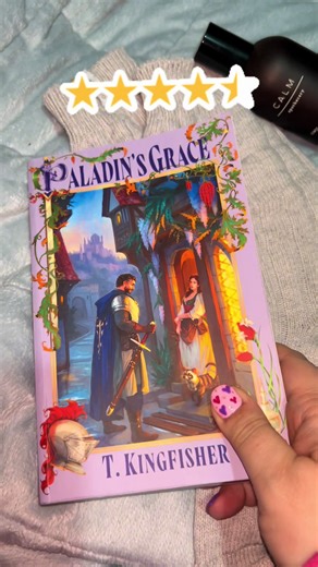 I am all in on the Saint of Steel series 💜 Paladin’s Grace was a perfect blend of cosy fantasy and creepy mystery that put me right back into my days of watching movies like Ella Enchanted and Princess Bride! The spice scenes didn’t feel cringey and slotted in nicely to the overall story and don’t get me started on Stephen and his knitting! I devoured this book and am already into book two, Paladin’s Strength! Love love love #paladinsgrace #tkingfisher #cosyfantasy #bookreview #saintofsteelseri