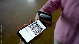 QR Code Scanner on the Smartphone close up. Checking the QR code of the vaccination certificate at the entrance to the building. QR Code Reader App.