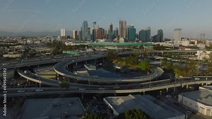 flying over freeways towards downtown LA skyline