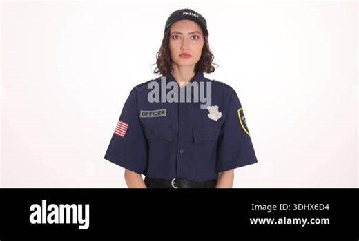 A woman cries in the dark under police sirens during interrogation