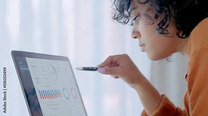 Financial student and data analyst studying graphs and charts on a laptop screen for an accounting assignment. Freelance entrepreneur checking online statistics and thinking of ideas to improve sales