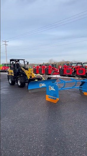KAGE SnowFire Snow Plow on A Gehl AL550 Articulated Loader