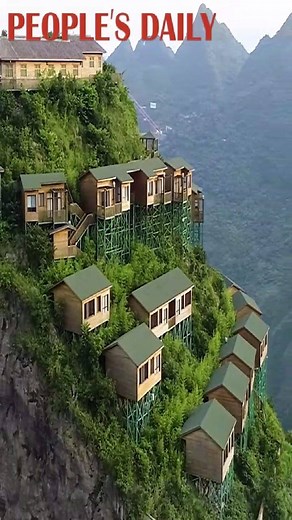 125K views · 1.9K shares | These houses built on the cliff of a mountain in SW China's #Guizhou Province can give you a unique perspective to view the scenery. Do you wanna go there? | People's Daily, China | Facebook