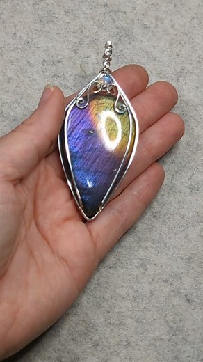 Final polish and this beauty is finished! I've been hoarding this Labradorite not knowing what to do with it because it is such a huge size, finally decided to just wrap it into this statement pendant. What do you think, would you wear something this large? It will be in Sunday's shop update #statementpiece #statementpendant #statementjewelry #wirewrappedpendant #wirewrap #purplelabradorite #labradoritejewelry | OxanaCrafts
