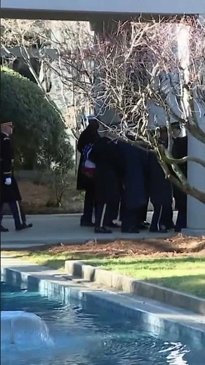 Jimmy Carter's casket carried out of the Carter Center in Atlanta