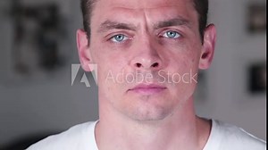A man puts on a face mask. Respiratory protection in a work process in a public place. Close-up.