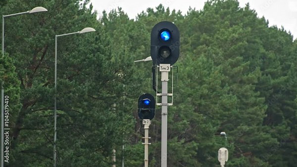 Railroad Track Junction with Signal Semaphore with Blue Light Designating Railway Train Maneuver Area