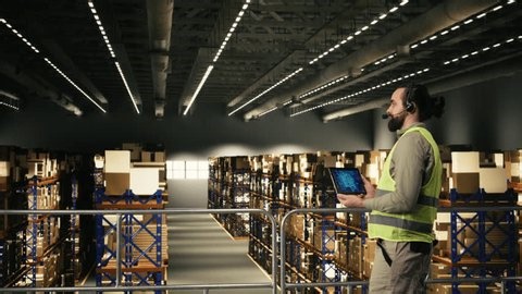 clip-4032155357-male-employee-operating-ai-powered-systems-on-tablet