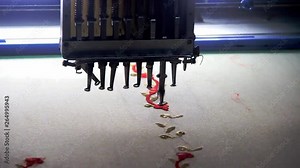 Textile - Professional and industrial embroidery machine. Machine embroidery is an embroidery process whereby a sewing machine or embroidery machine is used to create patterns on textiles.