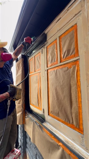 Spraying a window with Command Satin Premix Black. That smooth satin finish never gets old. 🖤