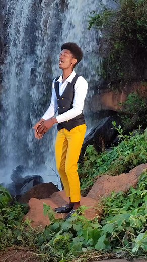 Expressive Outdoor Style by a Waterfall