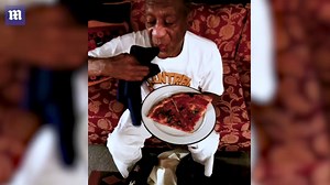 Bill Cosby daintily eats pizza after prison release