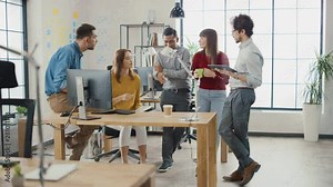 In the Modern Office: Diverse Group of Colleagues Have Meeting, Develop Strategy, Discuss Project Progress, Customer Experience Management also Have a bit Of Fun and Jokes. Smiling Businesspeople Chat