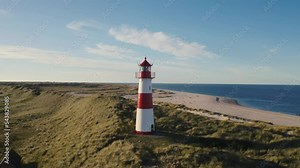 Sylt, Lighthouse Ellenbogen, Northernmost point of Germany. Schleswig-Holstein, North Sea. 4K drone. Beautiful tourist destination and attraction from above. Stock Video