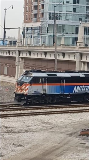 METX 209 leads an outbound Metra train out of LaSalle Street station 3/28/23