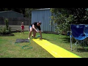 Kids play on Slip and Slide
