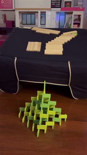 Keva Plank Contraption crushes domino pyramid!